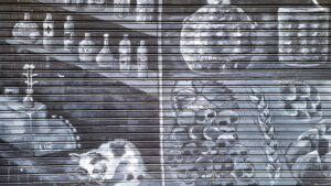 Black and white mural of a store