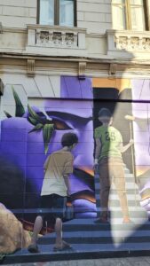 Two boys walking up a stair mural