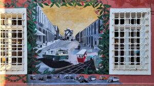 Mural of a road with train wagons