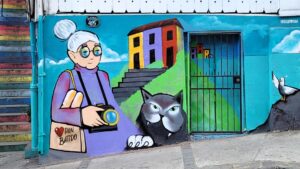 Grandma and a cat on a blue wall