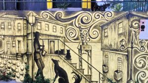 Black and yellow mural of a night saxophone player
