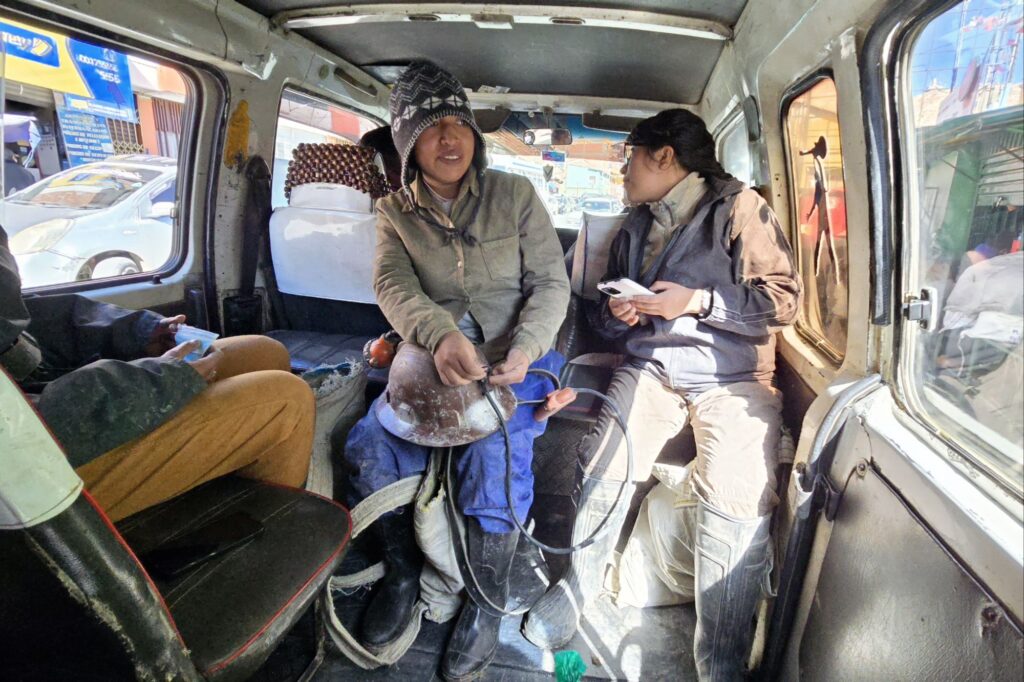 The tour operators visibly chummy during the ride up to the mines