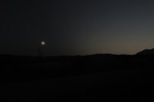 sun eclipse over a field