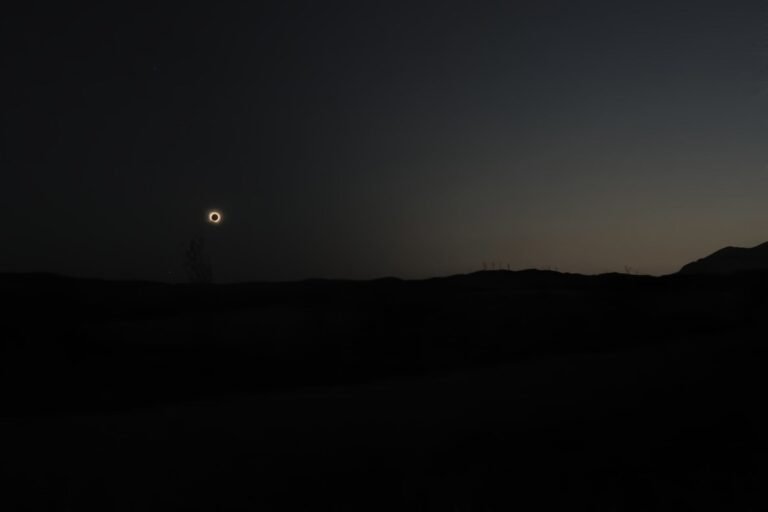home sun eclipse over a field