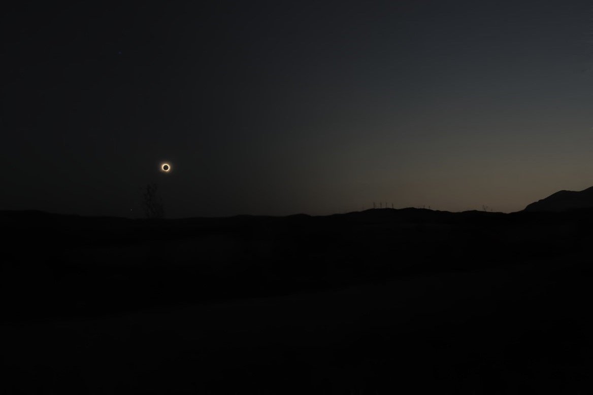 archive sun eclipse over a field
